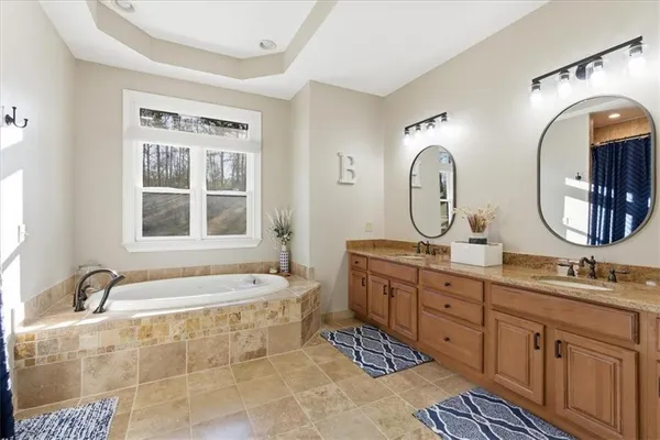 a bathroom with a toilet a sink and a shower