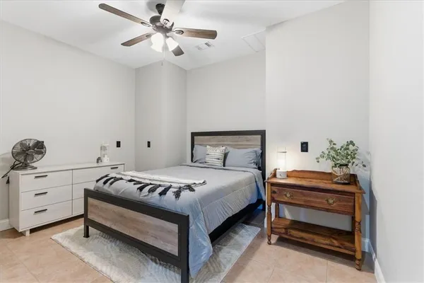 a view of a balcony with furniture and a floor to ceiling window