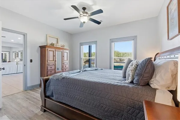 a view of a big house with wooden fence