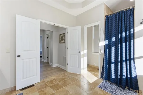 a view of a balcony with wooden floor