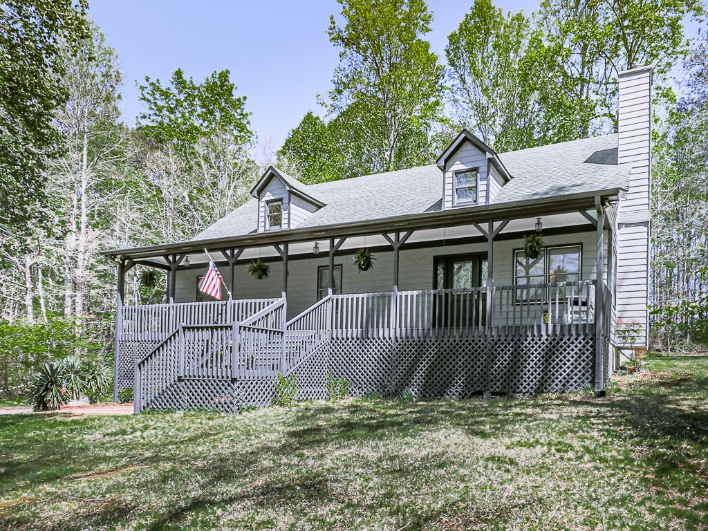 535 Mitchell Road Jasper, GA 30143 - Photo 1 of 1 a view of a house with a yard plants and large tree
