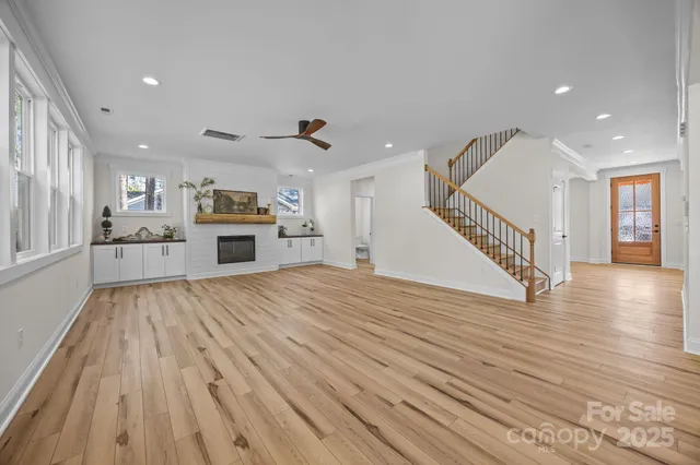 a view of a kitchen with a sink and a refrigerator