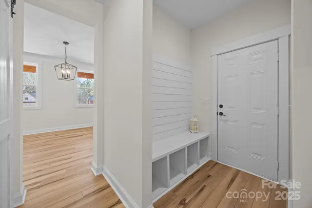 a bathroom with a bathtub and a hallway