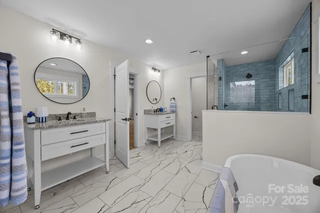 a living room with furniture and a mirror