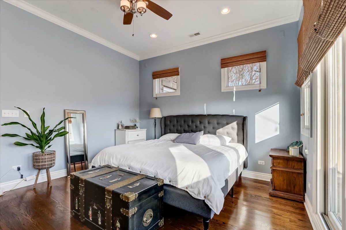 Undisclosed Address Chicago, IL 60657 - Photo 17 of 23 a bedroom with a bed and wooden floor