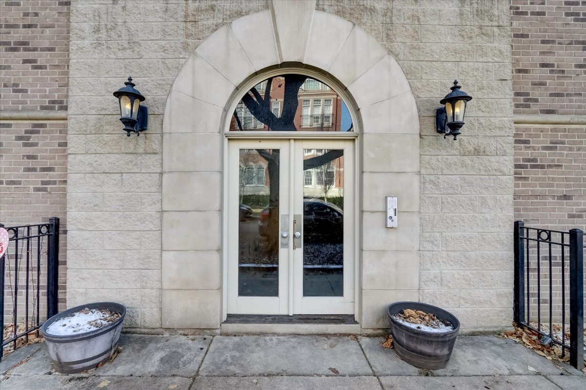 Undisclosed Address Chicago, IL 60657 - Photo 3 of 23 a front view of a house with outdoor seating