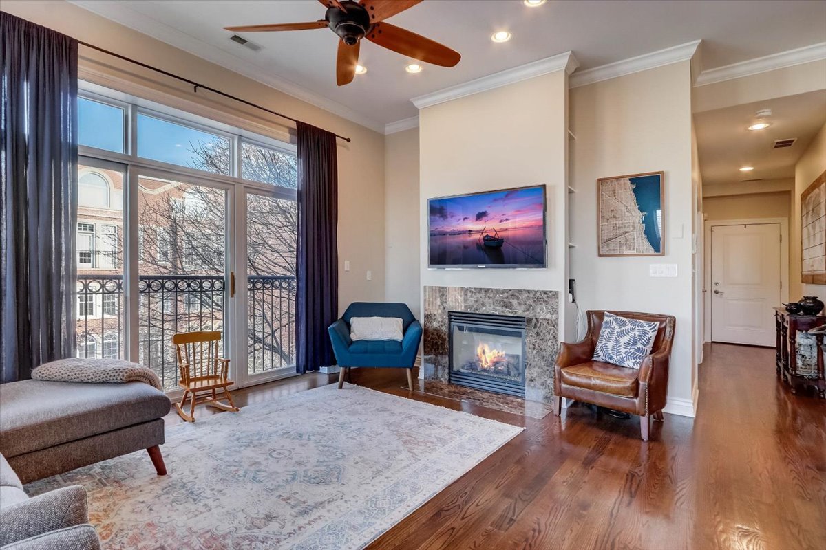 Undisclosed Address Chicago, IL 60657 - Photo 4 of 23 a living room with furniture and a fireplace