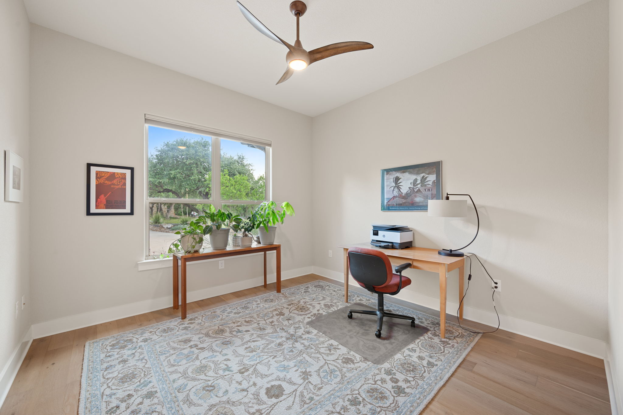 212 Marbella Way Georgetown, TX 78633 - Photo 28 of 40 a view of a workspace with furniture and a window