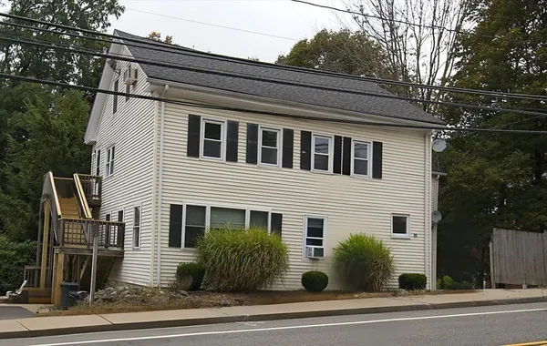 a view of a yard with a tree