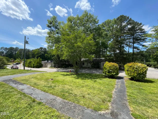 a view of a garden with a bench