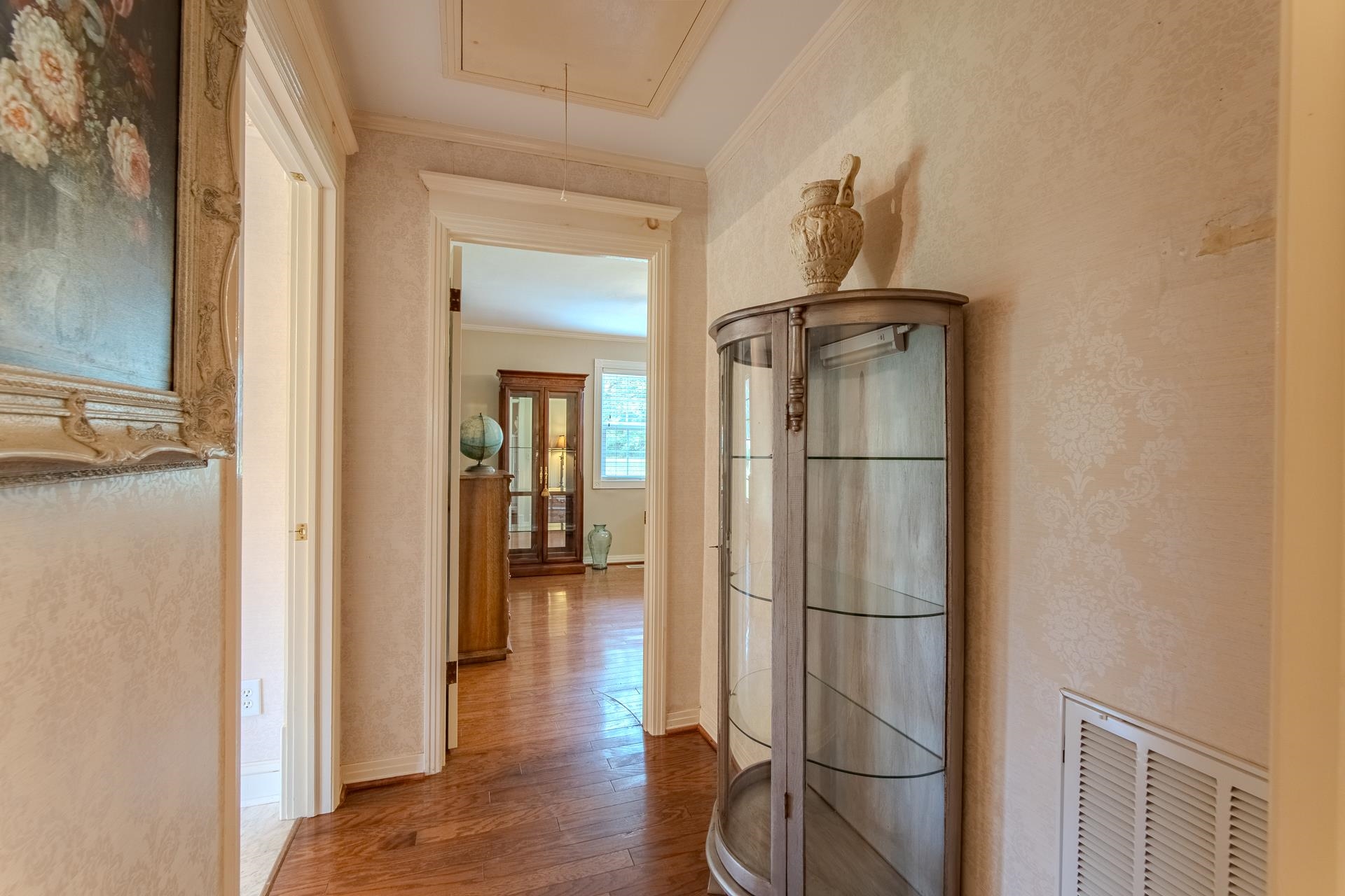 312 Smith Street Michie, TN 38357 - Photo 12 of 40 a view of a hallway with wooden floor and cabinet