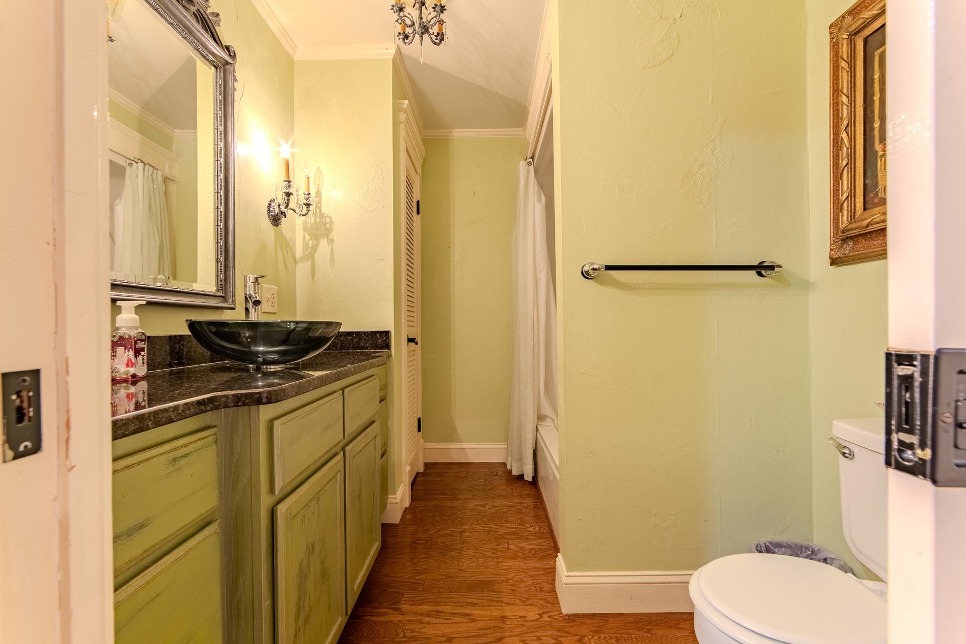 312 Smith Street Michie, TN 38357 - Photo 15 of 40 a bathroom with a sink a toilet a mirror and shower