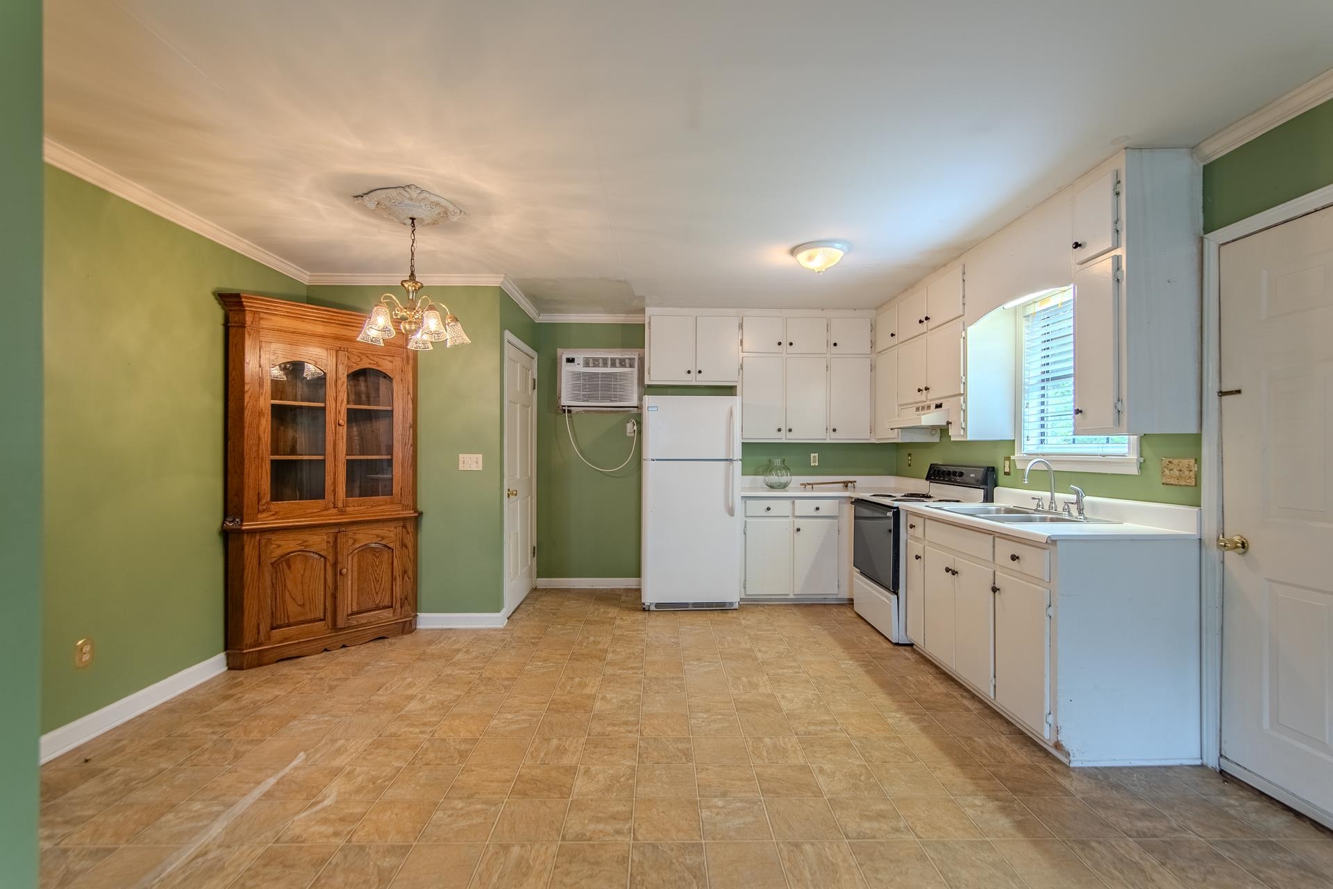 312 Smith Street Michie, TN 38357 - Photo 24 of 40 a large kitchen with cabinets and refrigerator