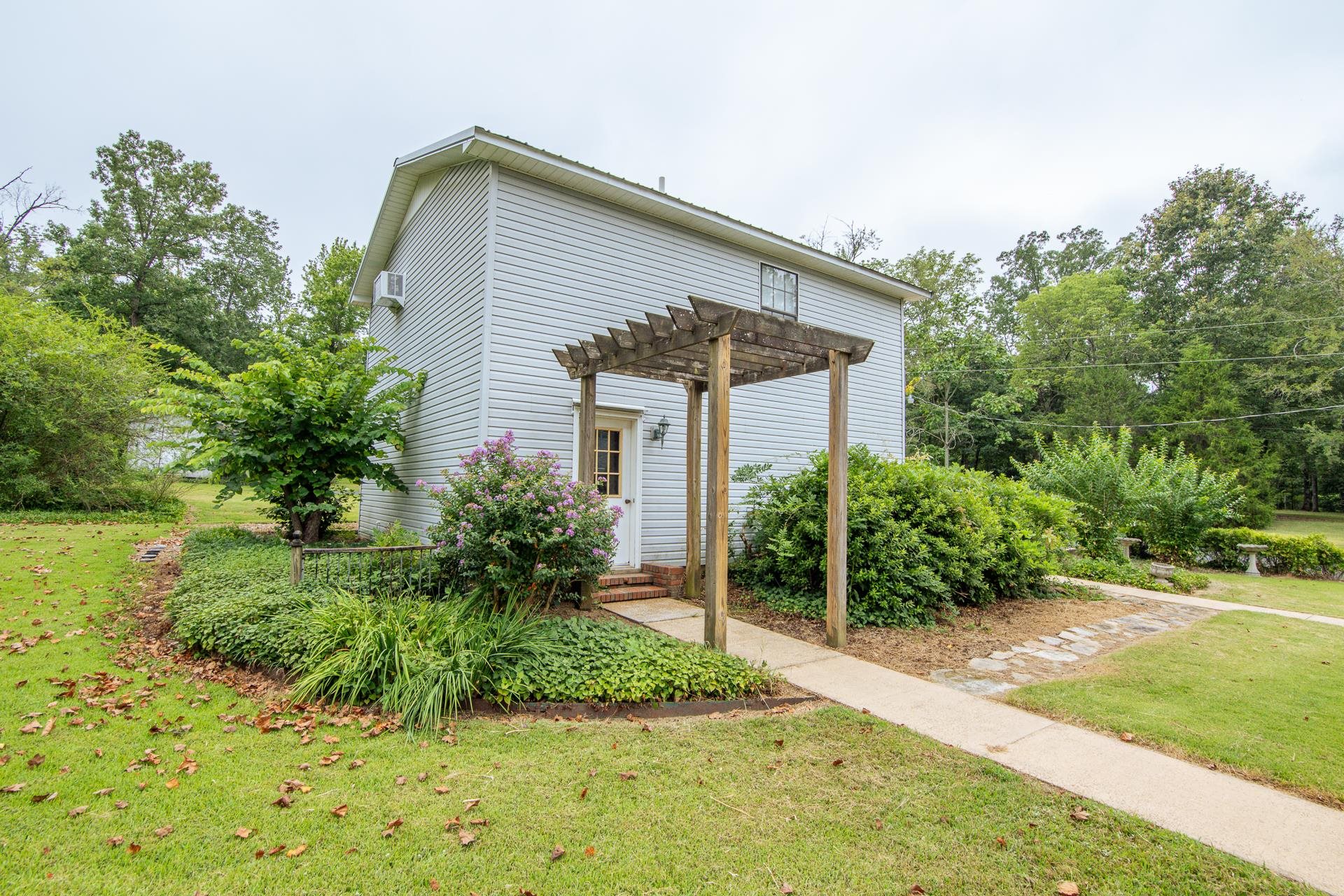 312 Smith Street Michie, TN 38357 - Photo 30 of 40 a front view of house with yard and green space