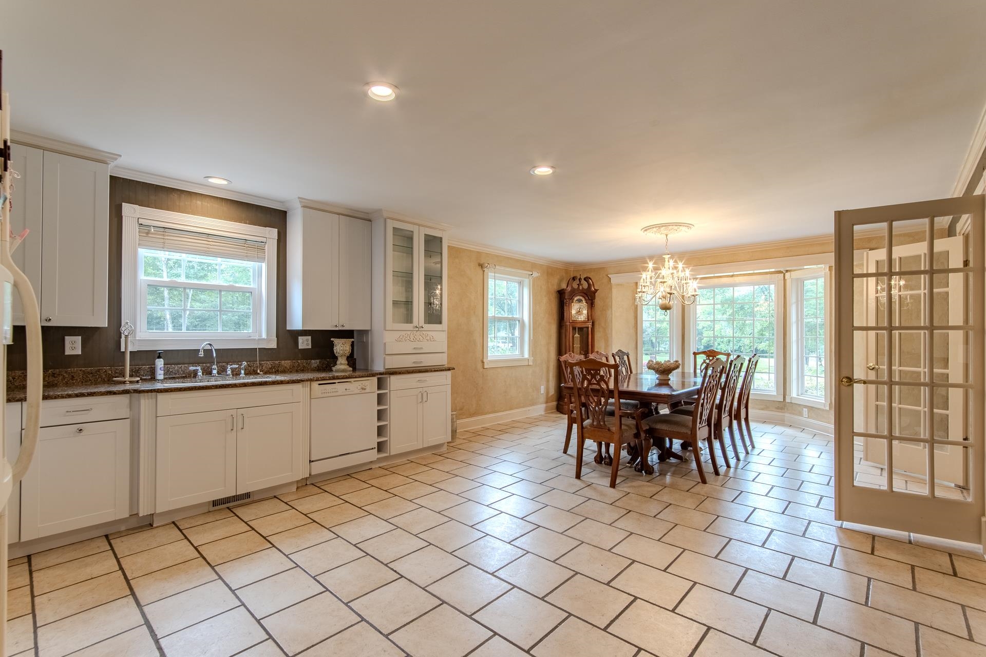 312 Smith Street Michie, TN 38357 - Photo 3 of 40 a large white kitchen with cabinets chairs and dining table