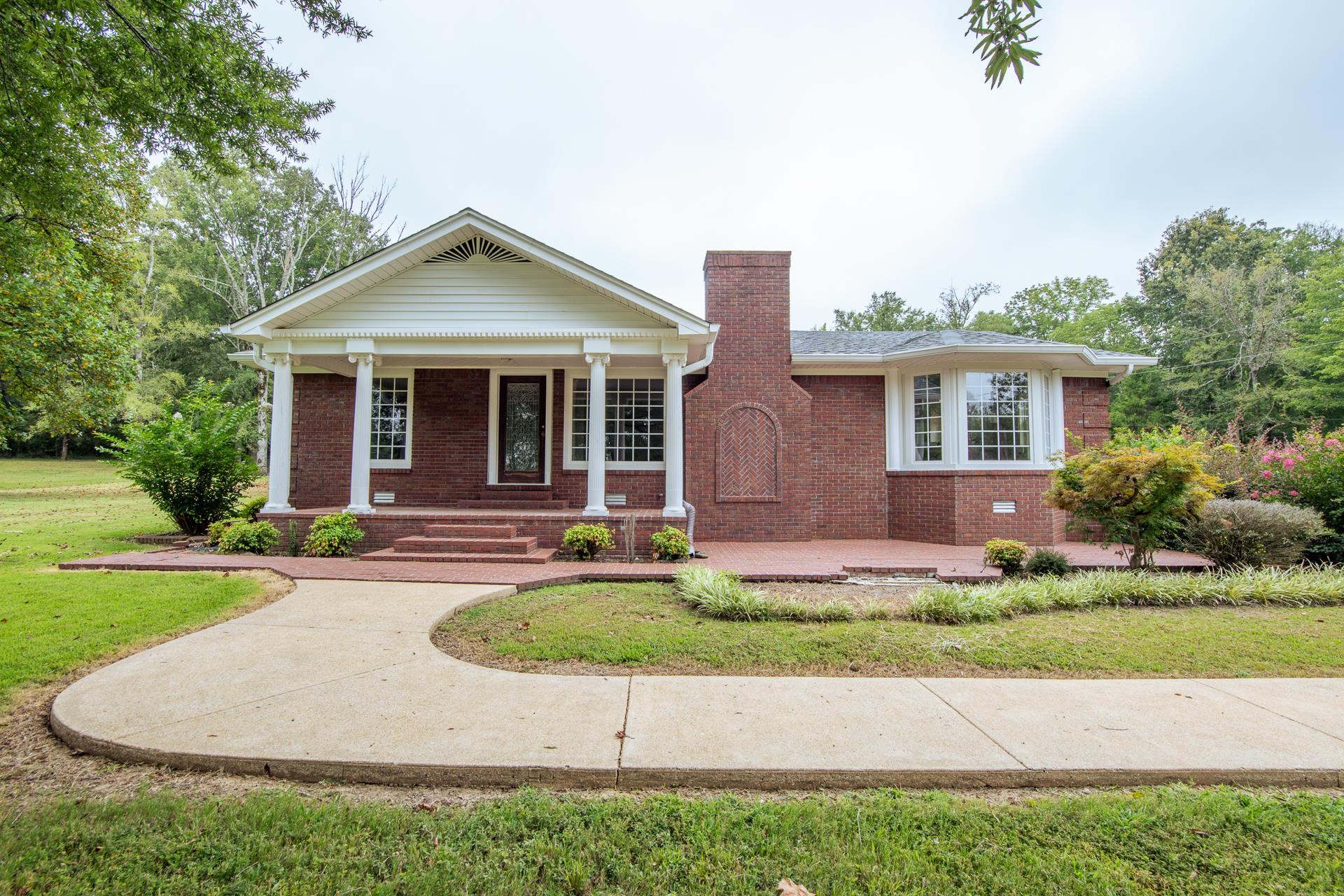 312 Smith Street Michie, TN 38357 - Photo 37 of 40 a front view of house with yard and green space