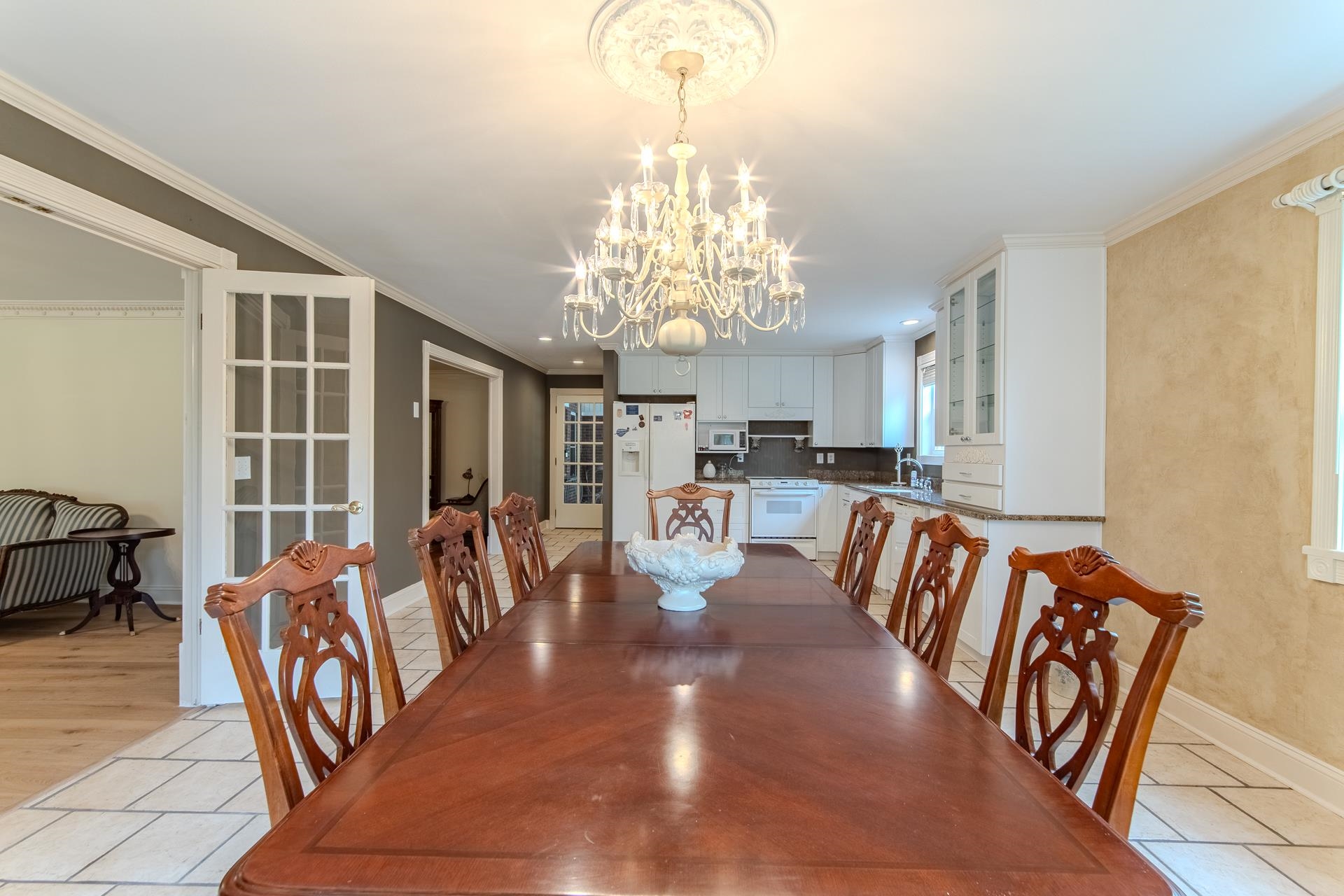 312 Smith Street Michie, TN 38357 - Photo 4 of 40 a view of a dining room with furniture a chandelier and wooden floor