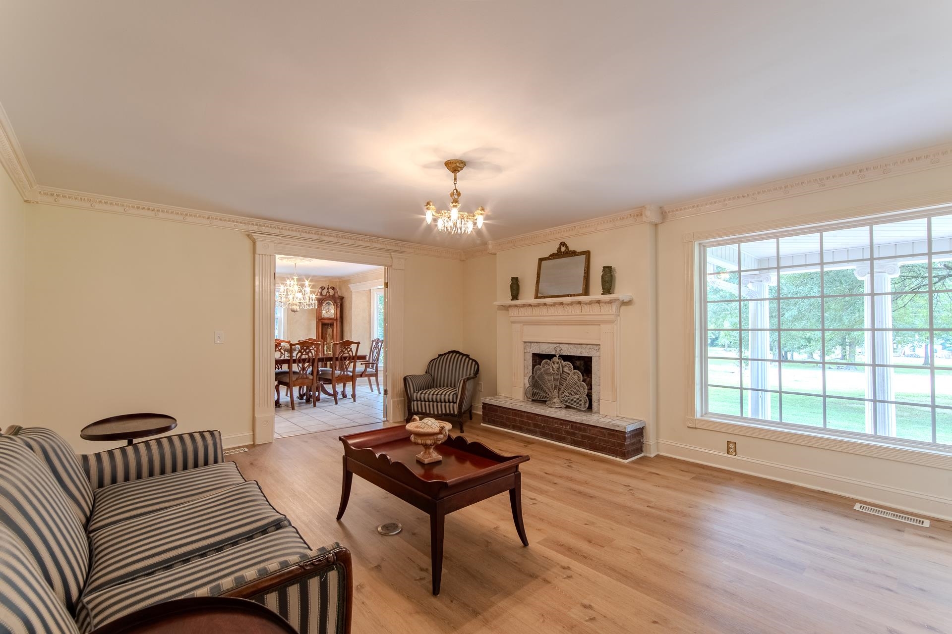 312 Smith Street Michie, TN 38357 - Photo 7 of 40 a living room with furniture a fireplace and a large window