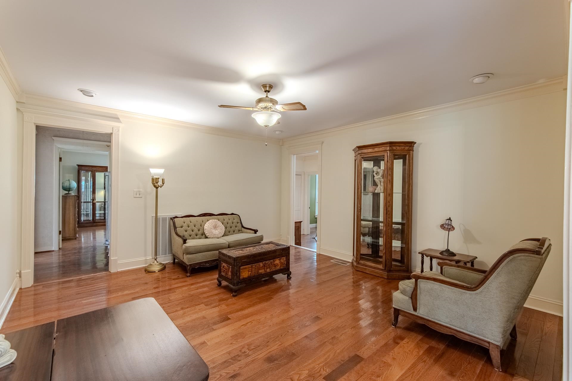 312 Smith Street Michie, TN 38357 - Photo 10 of 40 a living room with furniture and a chandelier