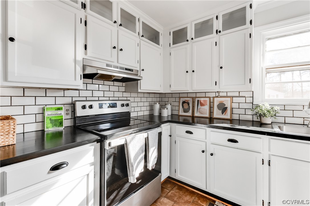1200 Boroughbridge Road Richmond, VA 23225 - Photo 15 of 43 a kitchen with stainless steel appliances a stove a white cabinet and a granite counter tops