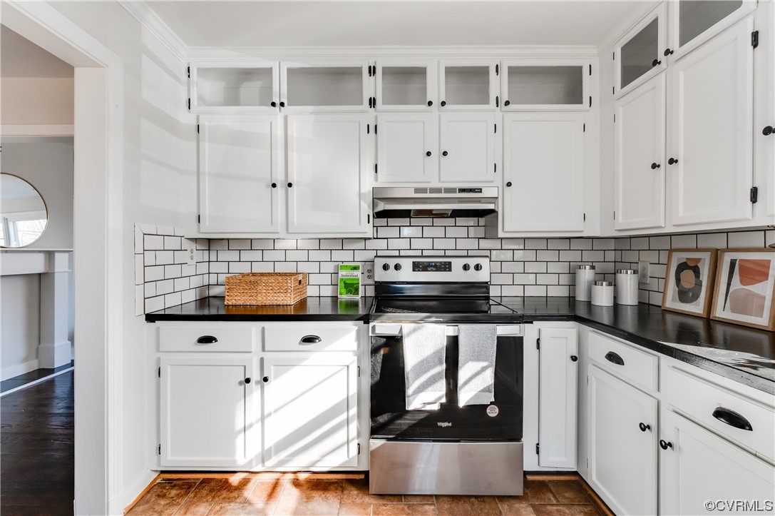 1200 Boroughbridge Road Richmond, VA 23225 - Photo 17 of 43 a kitchen with stainless steel appliances granite countertop a stove and white cabinets
