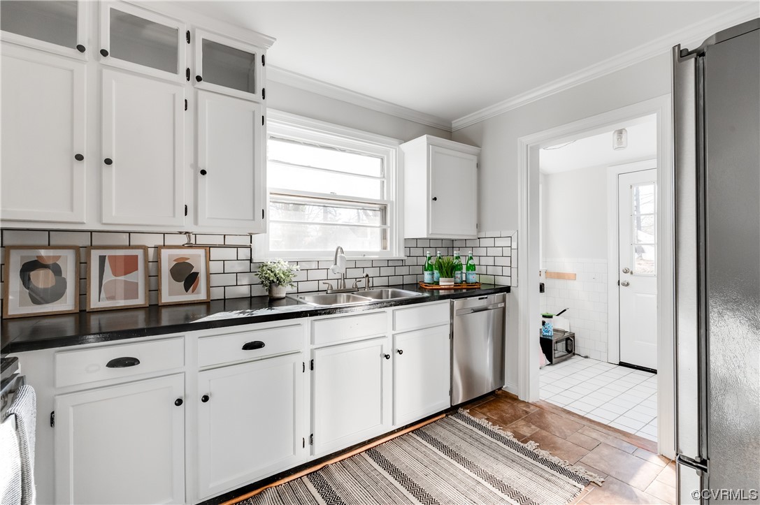 1200 Boroughbridge Road Richmond, VA 23225 - Photo 19 of 43 a kitchen with stainless steel appliances granite countertop white cabinets and window