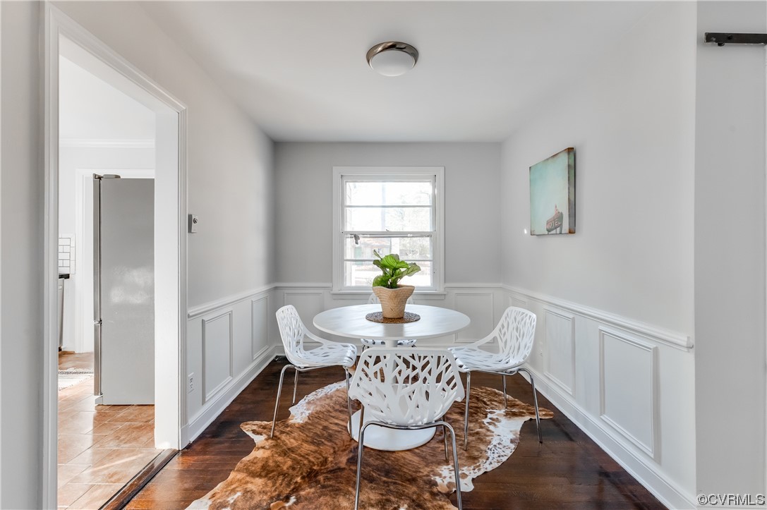 1200 Boroughbridge Road Richmond, VA 23225 - Photo 10 of 43 a view of a dining room with furniture wooden floor and a chandelier