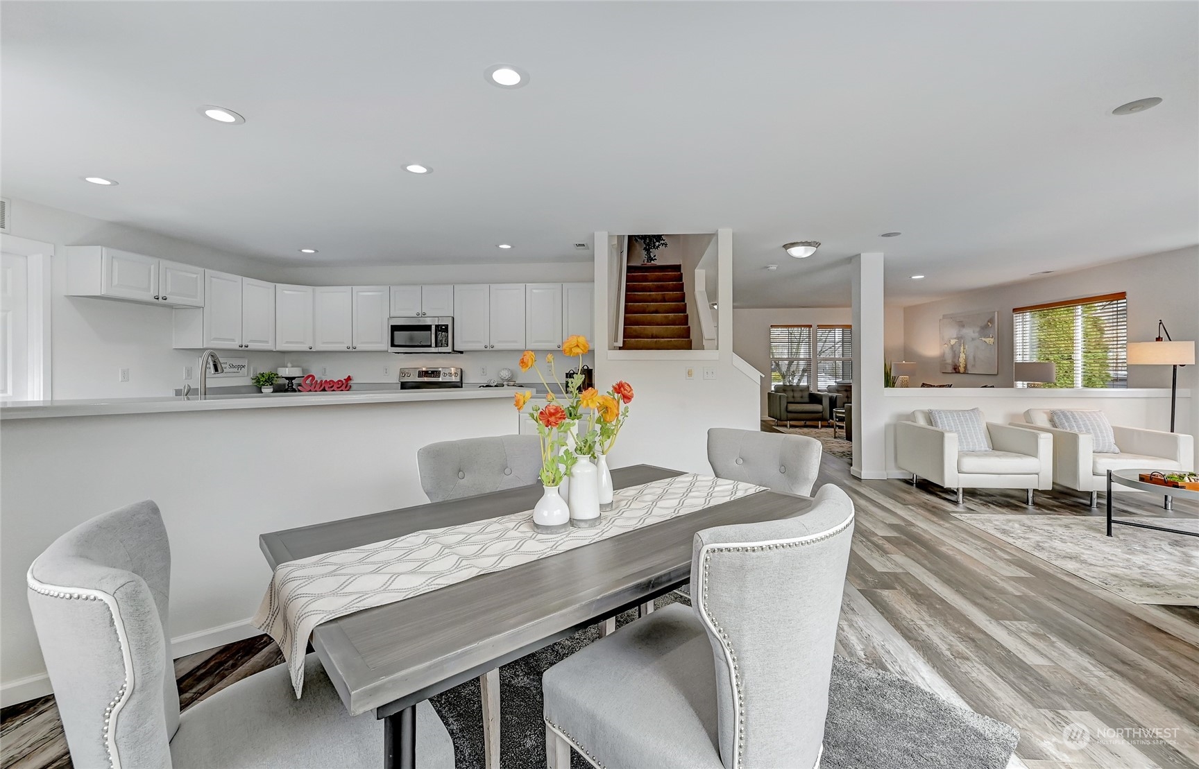 19110 13th Avenue Southeast Bothell, WA 98012 - Photo 11 of 32 a living room with stainless steel appliances furniture a dining table and kitchen view
