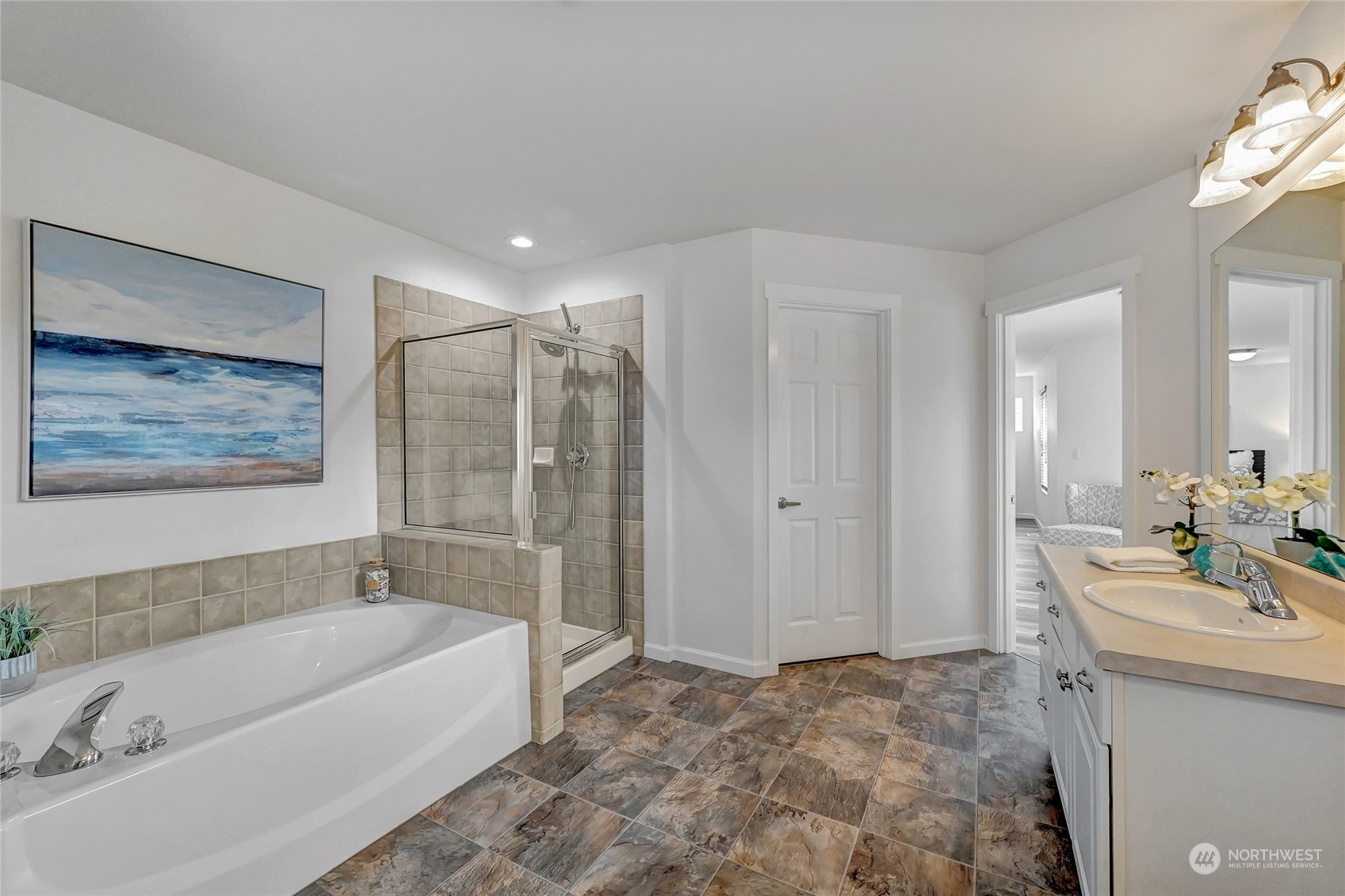 19110 13th Avenue Southeast Bothell, WA 98012 - Photo 19 of 32 a bathroom with a tub a sink and mirror