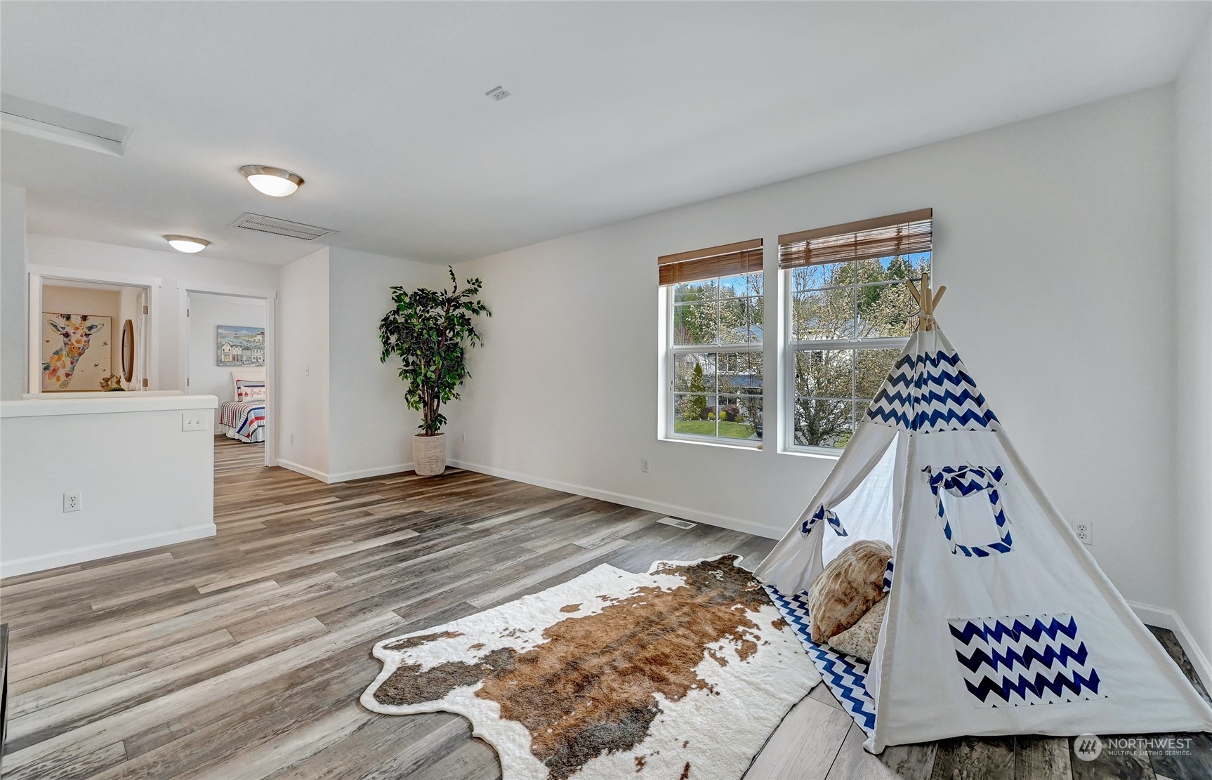 19110 13th Avenue Southeast Bothell, WA 98012 - Photo 21 of 32 a bedroom with a bed and a window