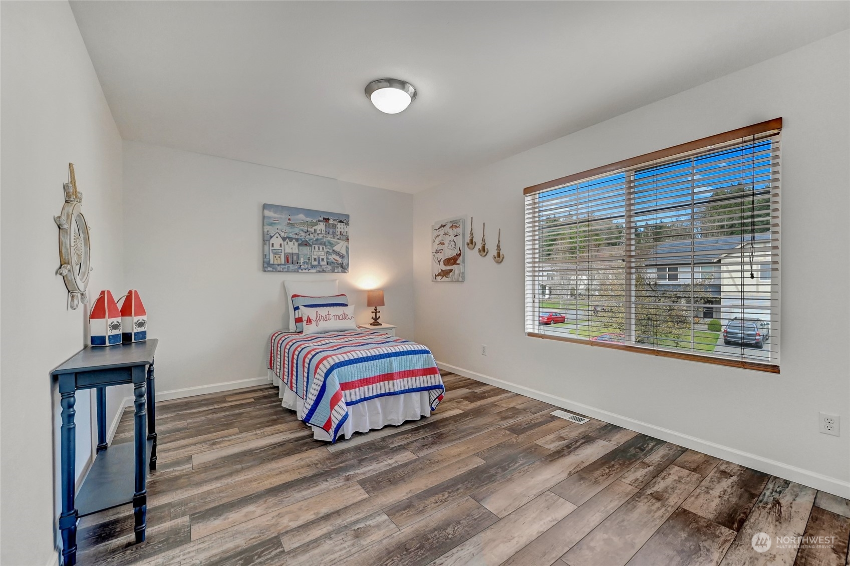 19110 13th Avenue Southeast Bothell, WA 98012 - Photo 22 of 32 a bedroom with a bed and a painting on the wall