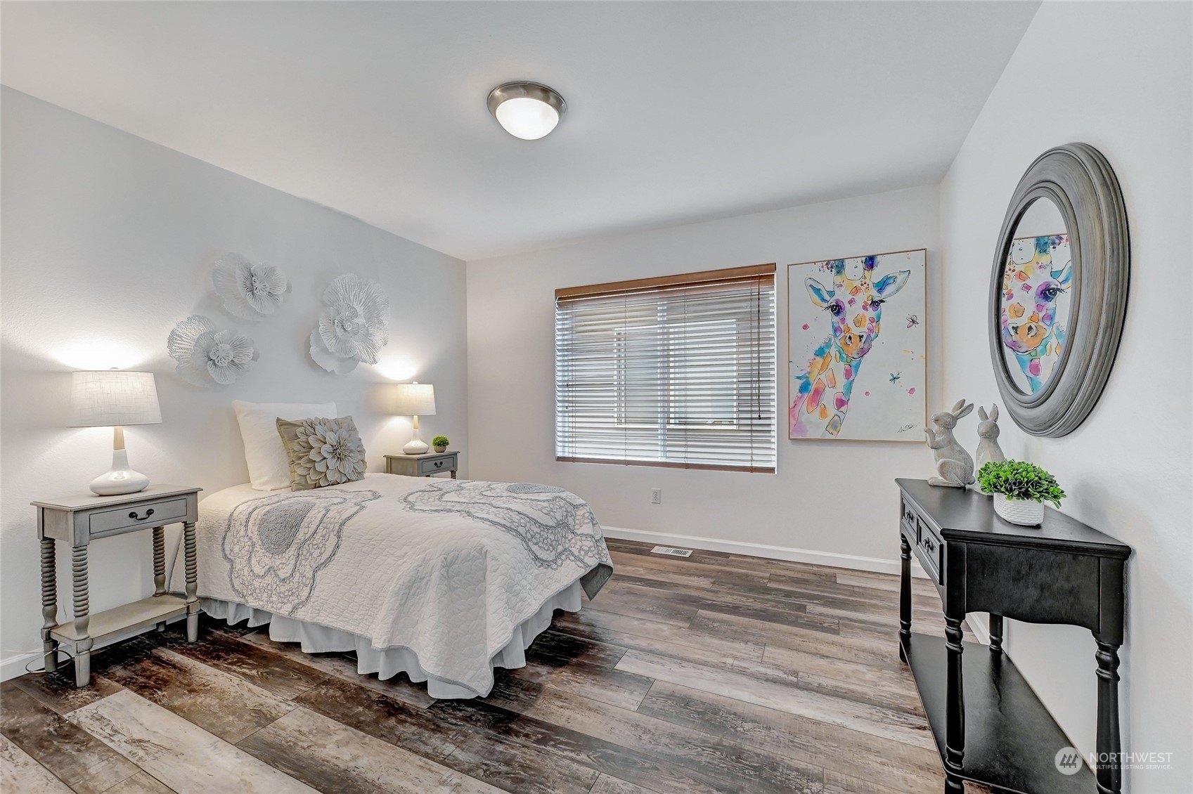 19110 13th Avenue Southeast Bothell, WA 98012 - Photo 24 of 32 a bedroom with a bed a window and a lamp on dresser
