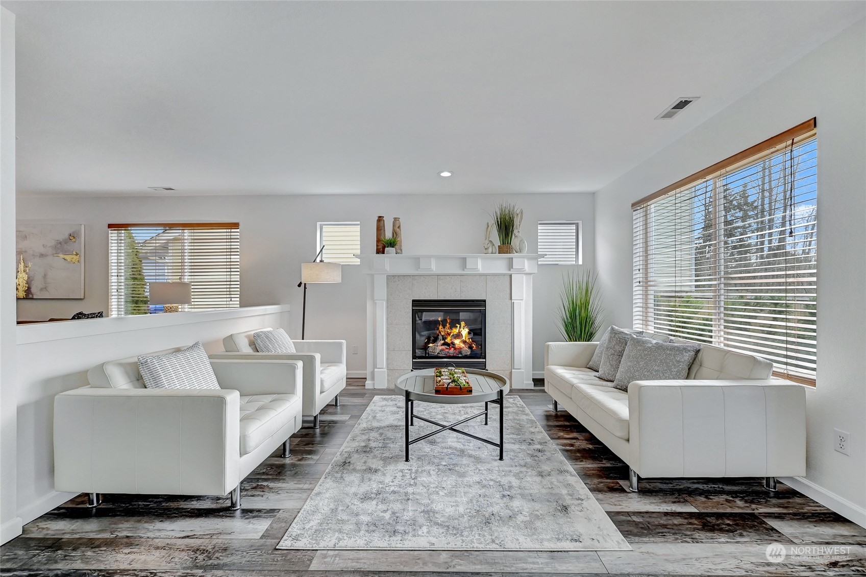 19110 13th Avenue Southeast Bothell, WA 98012 - Photo 7 of 32 a living room with furniture and a fireplace