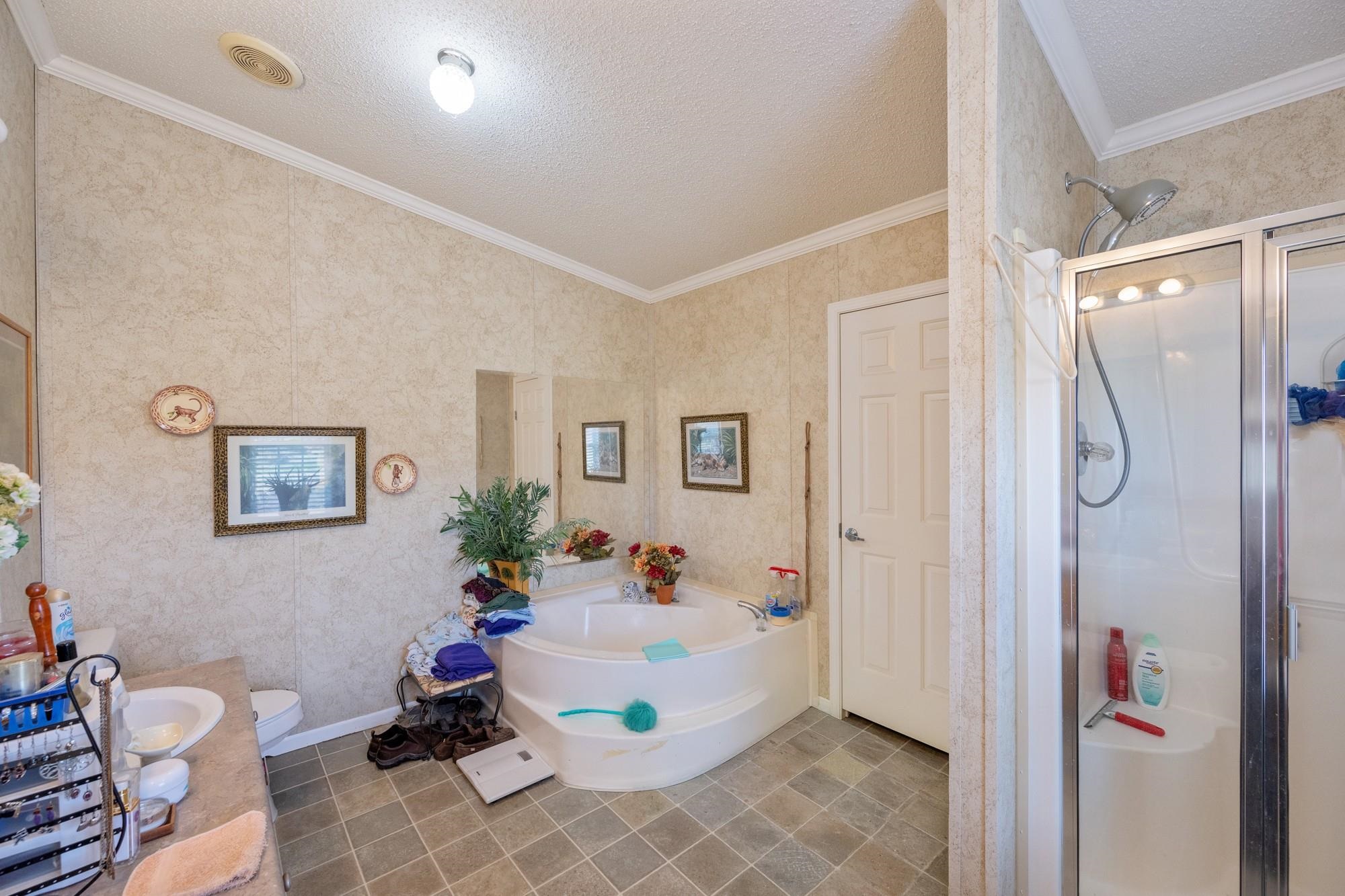 416 Haney School Road Decaturville, TN 38329 - Photo 15 of 35 a bed room with a bed and a chair