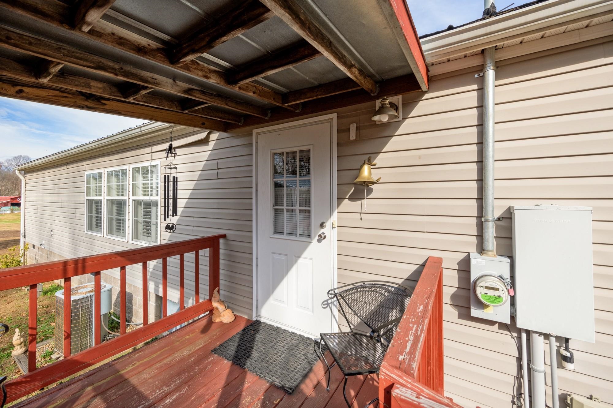 416 Haney School Road Decaturville, TN 38329 - Photo 20 of 35 a view of a patio with wooden floor