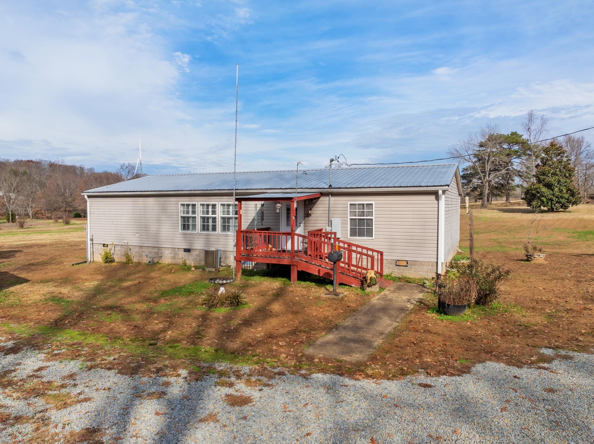 416 Haney School Road Decaturville, TN 38329 - Photo 22 of 35 a view of a house with backyard