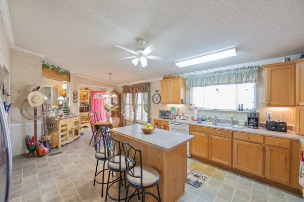 a view of a kitchen and dining room