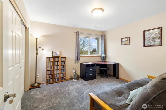 a bedroom with a bed and furniture