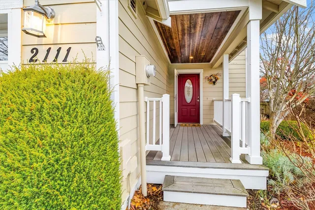 a view of front door of house with stairs