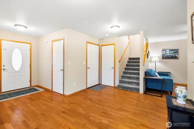 a view of an empty room with stairs and ventilation