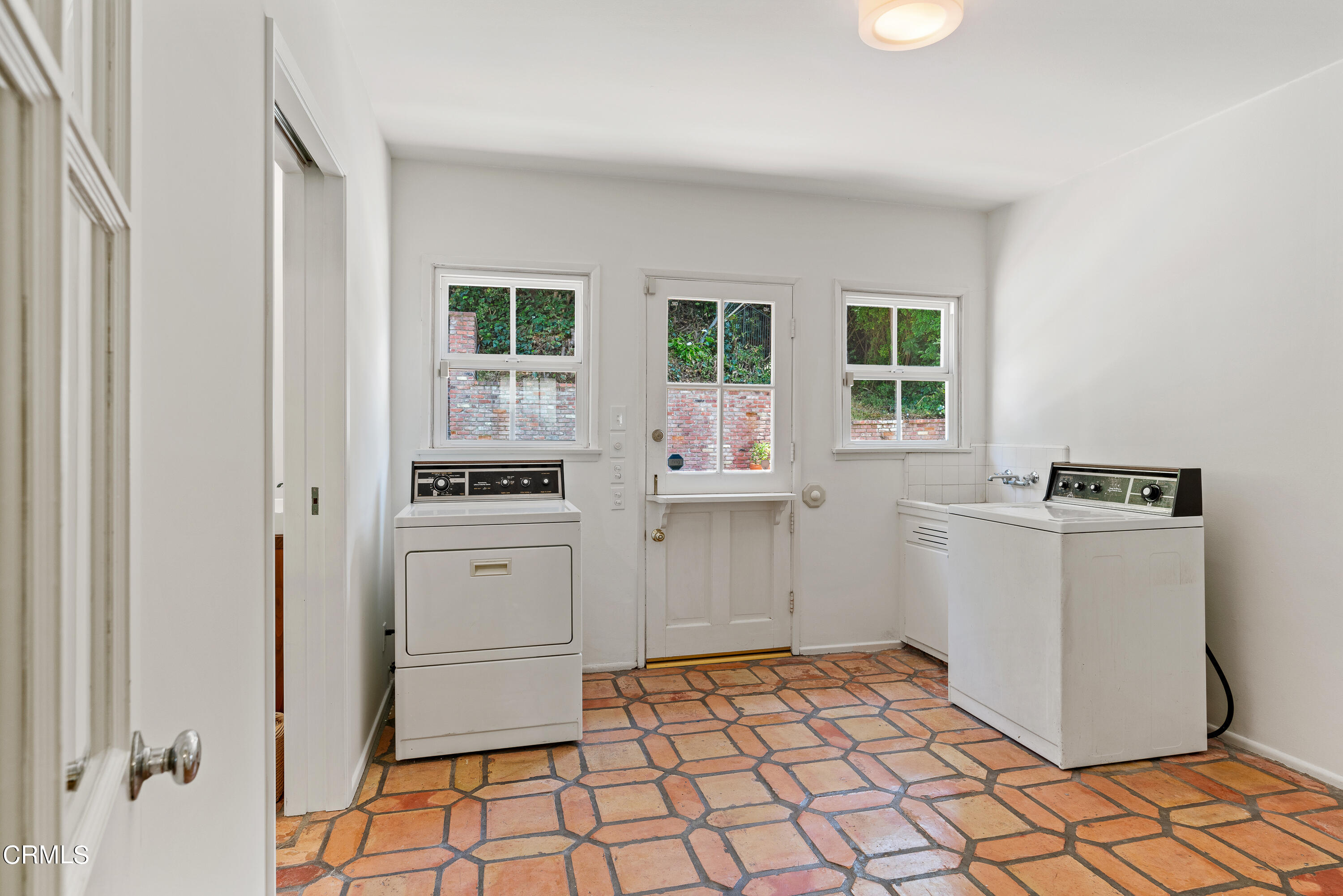 2040 Roscomare Road Los Angeles, CA 90077 - Photo 12 of 30 a kitchen with a refrigerator and white cabinets