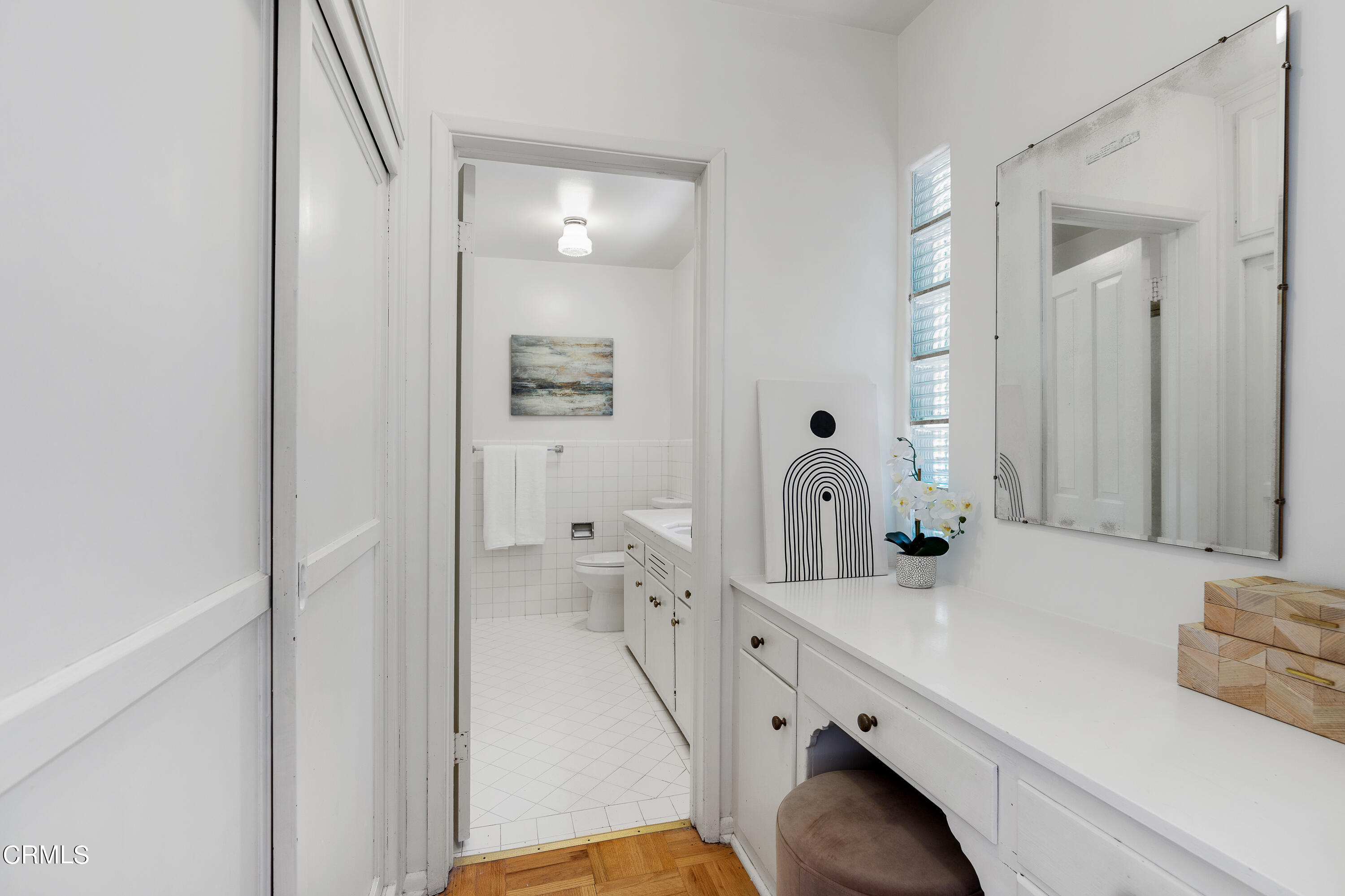 2040 Roscomare Road Los Angeles, CA 90077 - Photo 18 of 30 a bathroom with a double vanity sink and mirror