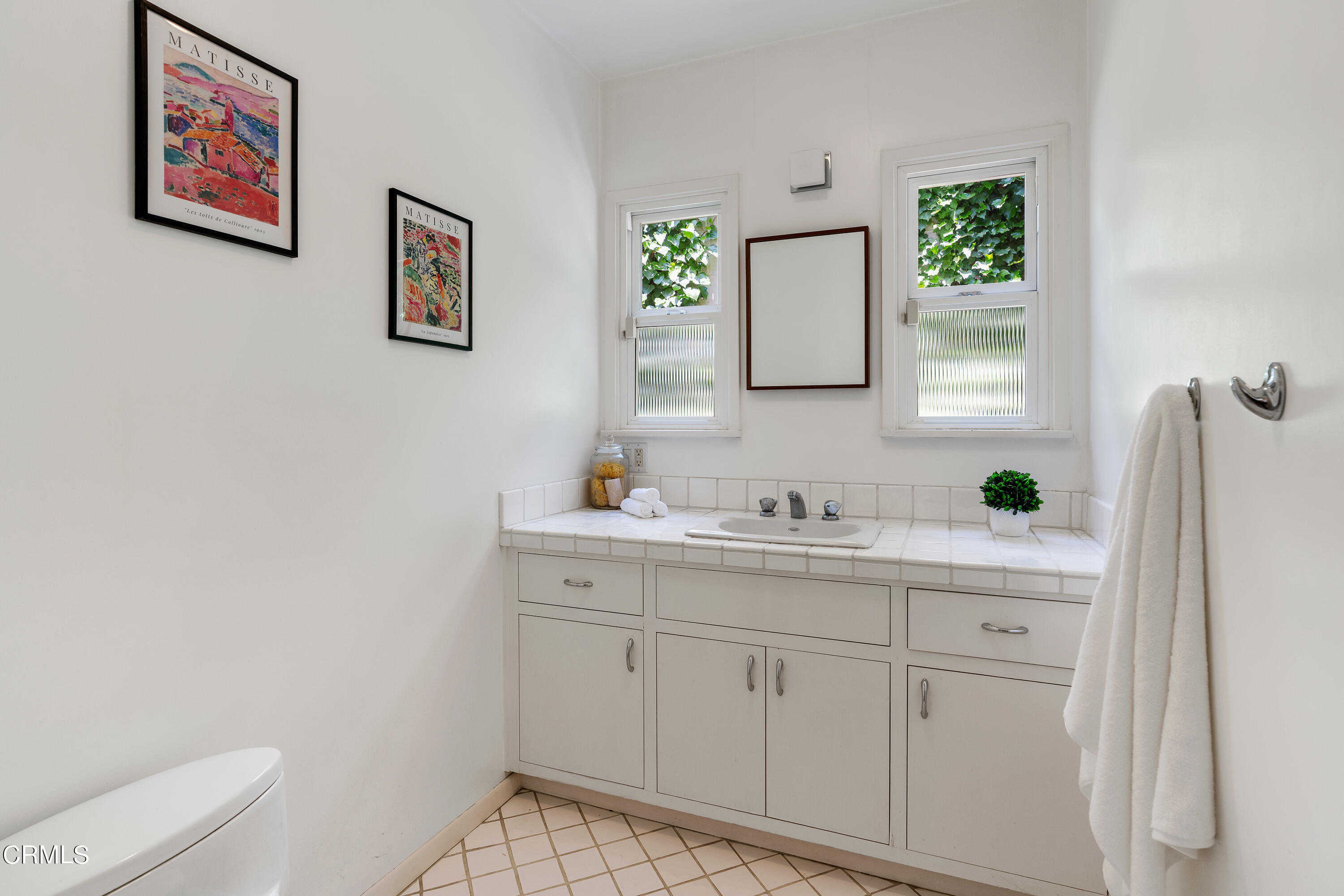 2040 Roscomare Road Los Angeles, CA 90077 - Photo 22 of 30 a bathroom with a toilet sink and mirror