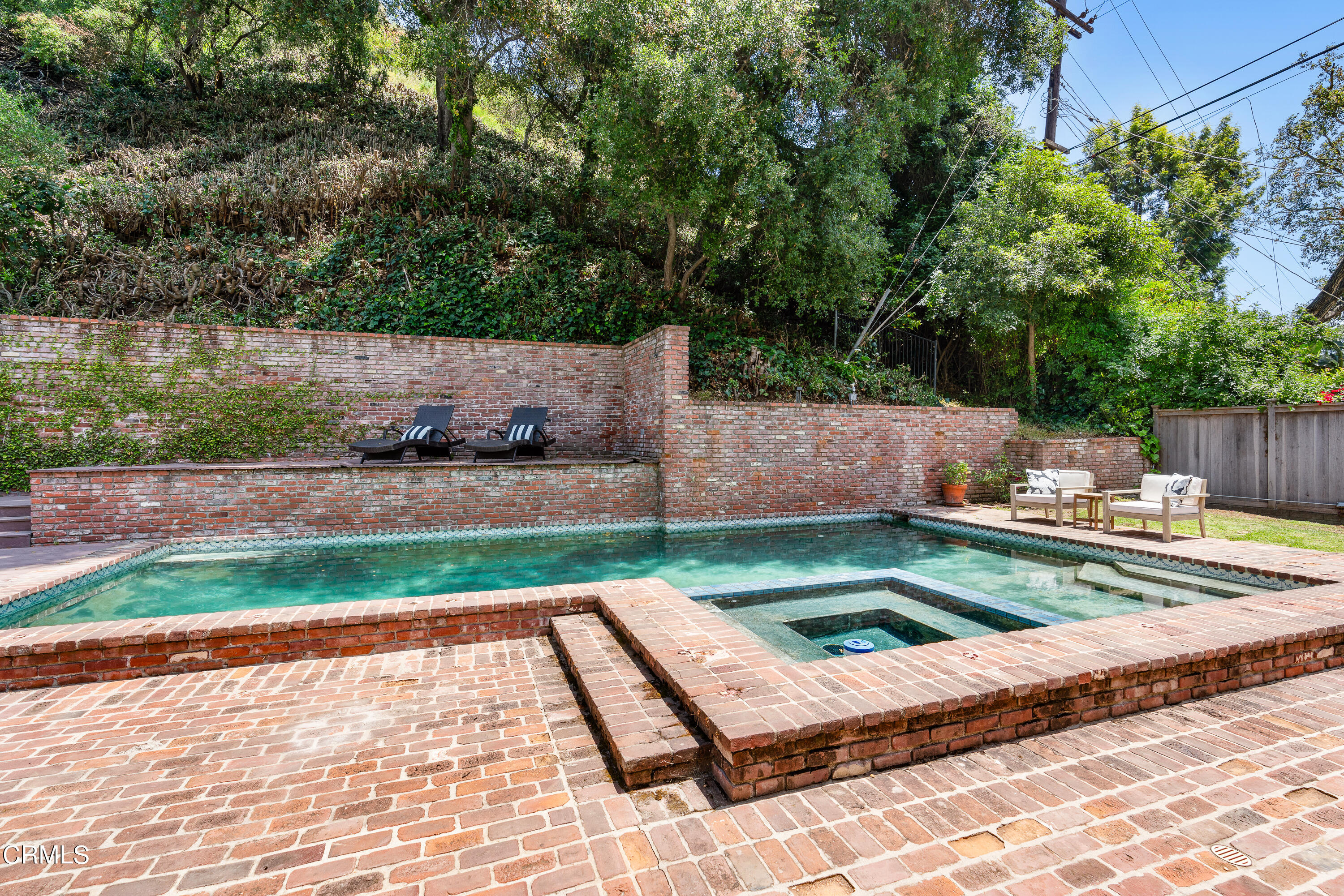 2040 Roscomare Road Los Angeles, CA 90077 - Photo 26 of 30 a view of a backyard with sitting area