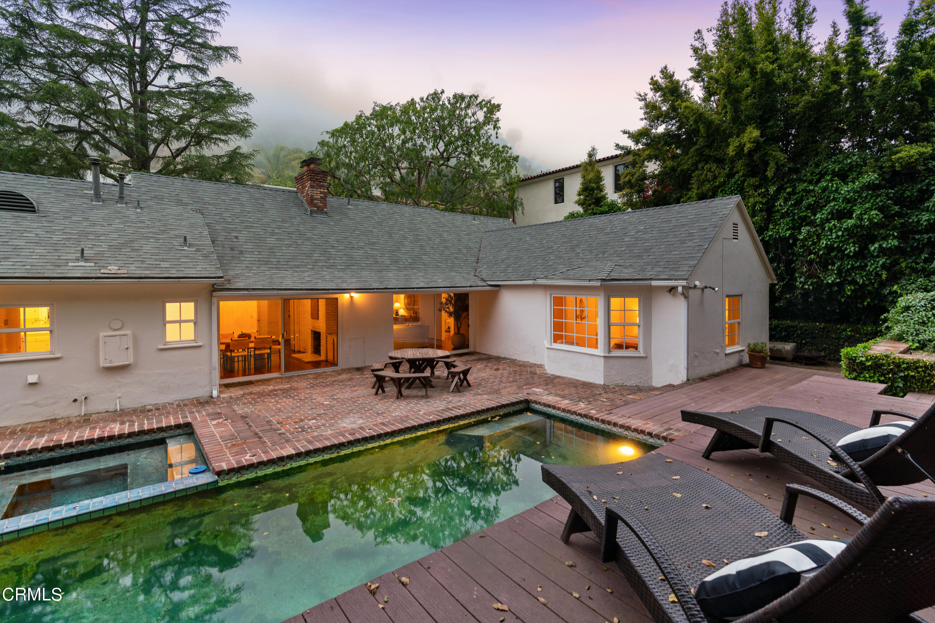 2040 Roscomare Road Los Angeles, CA 90077 - Photo 29 of 30 a view of a swimming pool with lounge chairs in patio
