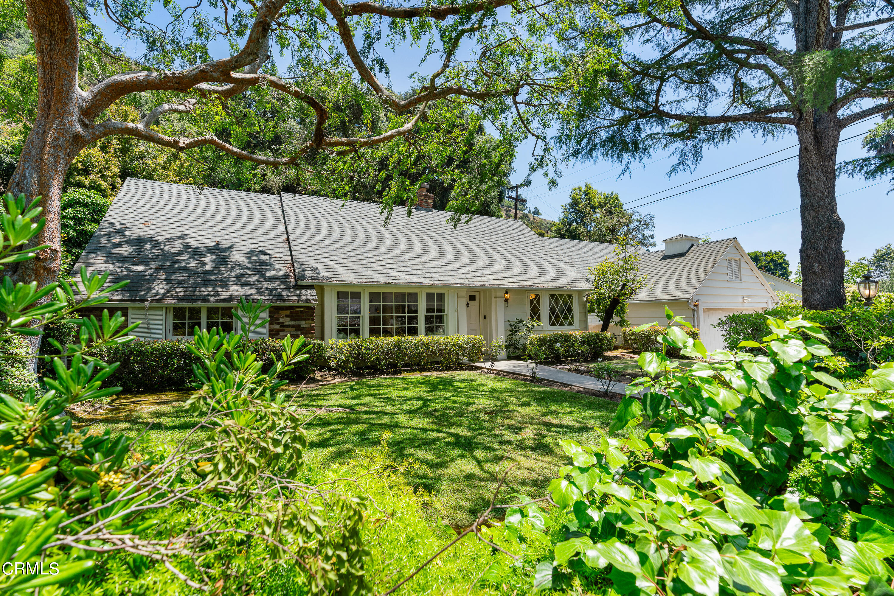 2040 Roscomare Road Los Angeles, CA 90077 - Photo 30 of 30 a view of a house with a yard and sitting area