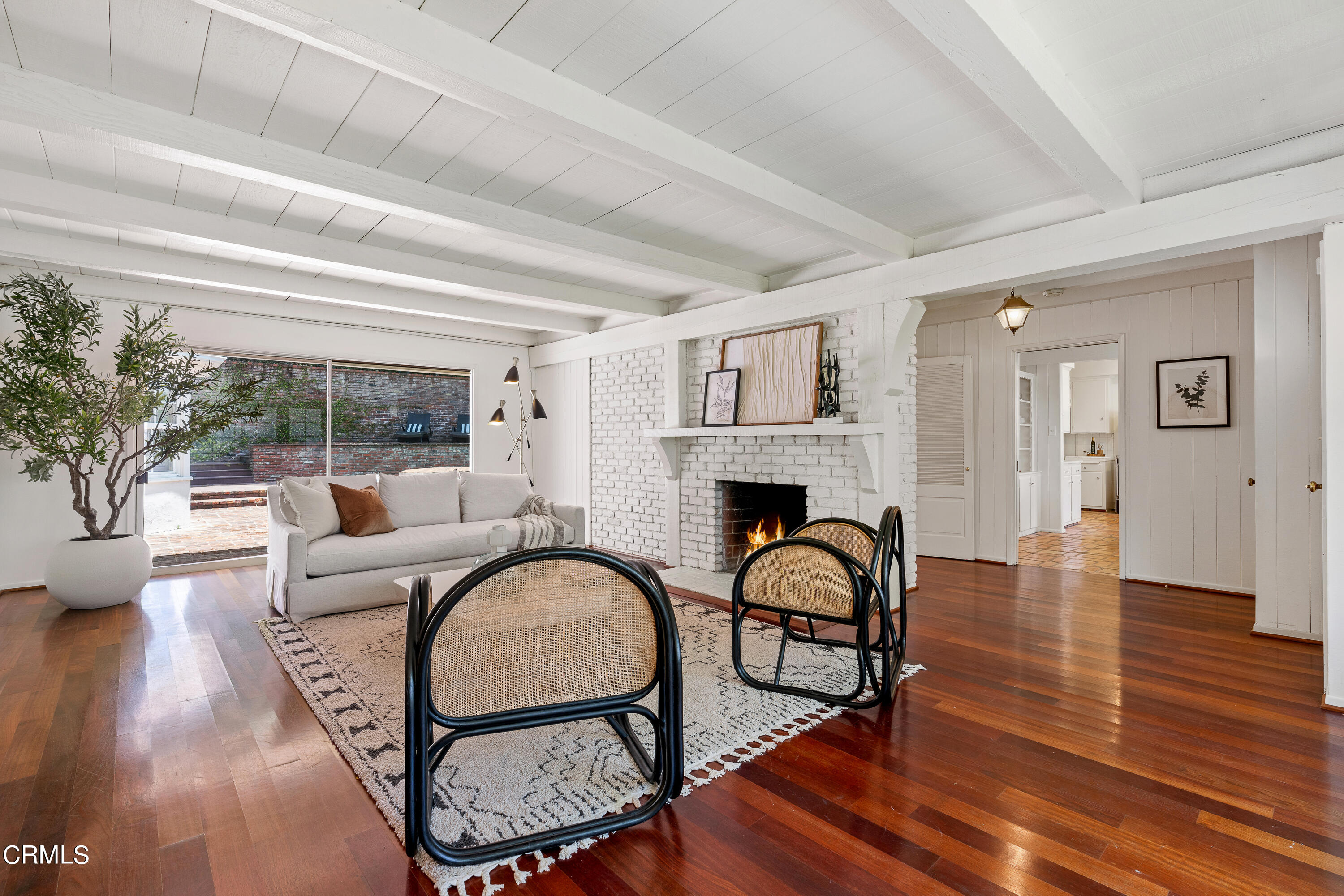 2040 Roscomare Road Los Angeles, CA 90077 - Photo 3 of 30 a living room with furniture a fireplace and potted plants