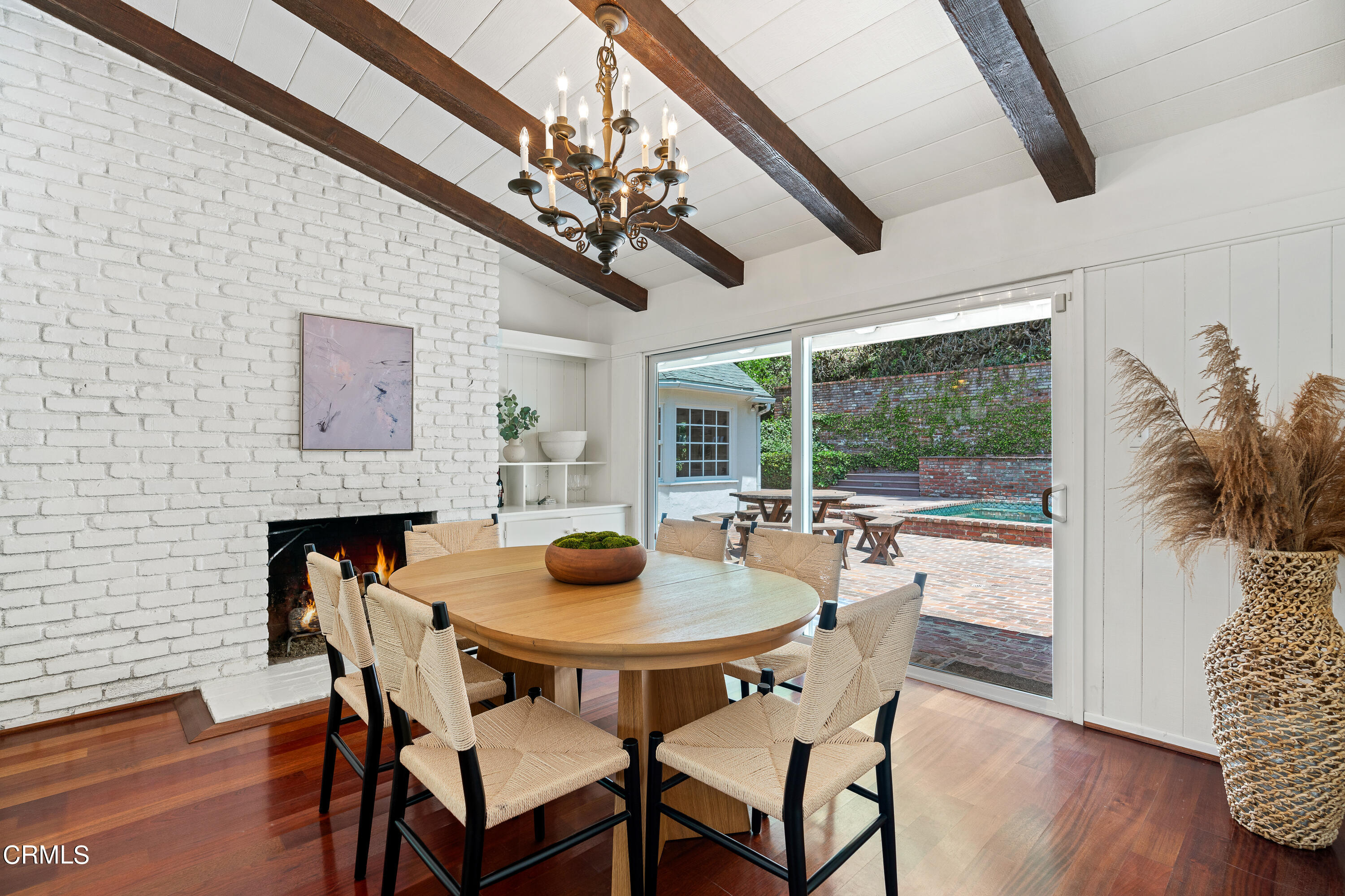 2040 Roscomare Road Los Angeles, CA 90077 - Photo 6 of 30 a view of a dining room with furniture wooden floor and chandelier