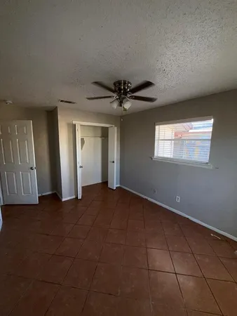 a view of a livingroom with an empty space and a entryway