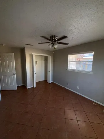 a view of a livingroom with an empty space and a entryway